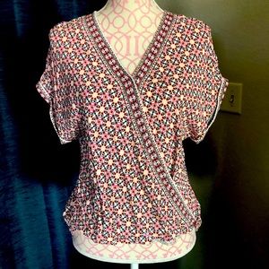 Pink and black wrap top